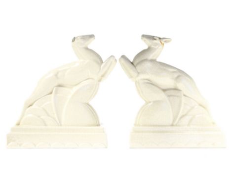 John Adams for Carter, Stabler and Adams, Poole, a pair of Art Deco leaping deer bookends, impressed marks, 21cm high (2)