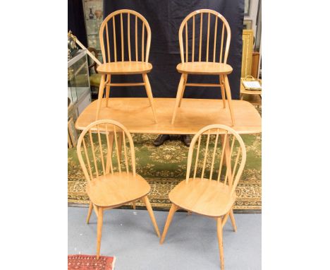 An Ercol light elm and beech table and four Windsor chairs