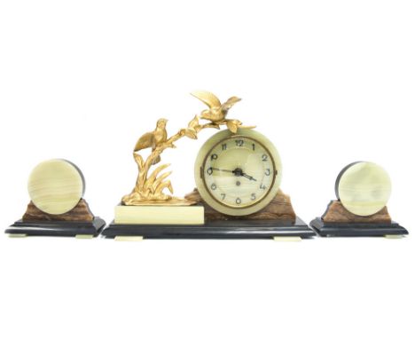 A French Art Deco onyx and marble clock garniture, the 6 inch green face with applied Arabic numerals, sumounted buy a gilt m
