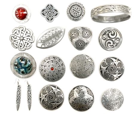 A collection of Celtic style pewter brooches, including Cornish and Scottish examples, together with Ruskin type cabouchon br