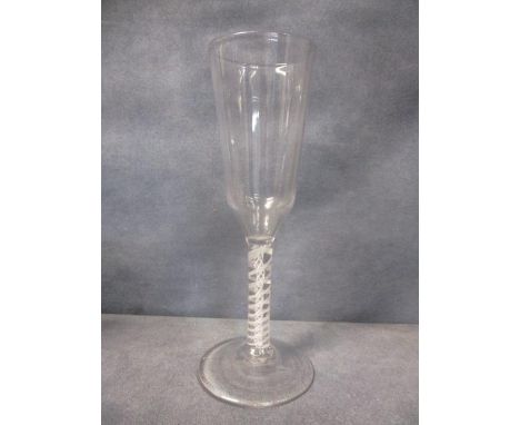 An opaque twist ale glass with tall, ogee shaped bowl, on a plain opaque twist stem, central twist, surrounded by a six ply t