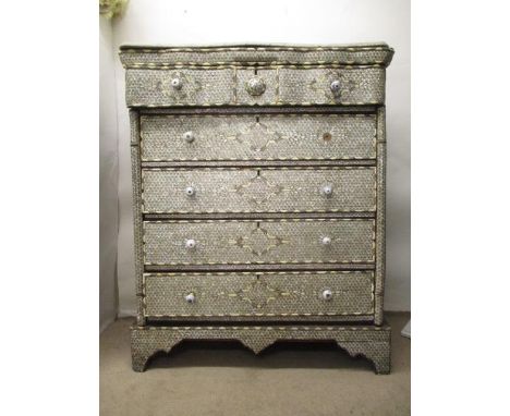 A 19th century possibly Syrian mother of pearl, bone and white metal inlaid chest, with an associated marble top, over a serp