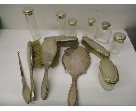 A matching set of silver vanity case accessories by Goldsmiths &amp; Silversmiths Co Ltd London 1912, 1913 and 1914, comprisi