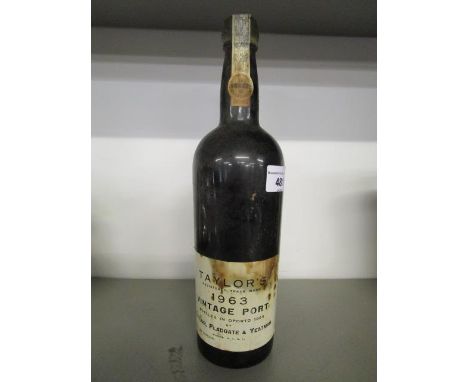 A bottle of Taylor's vintage port 1963, level to lower neck 