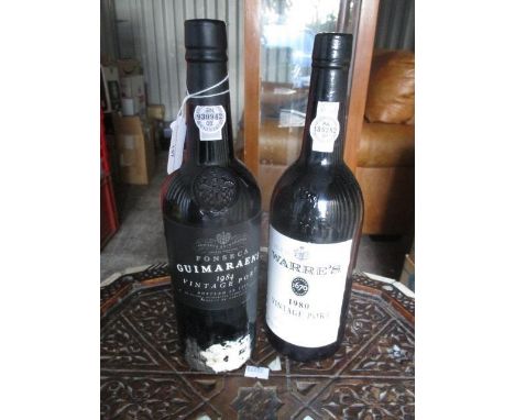 A bottle of Warres 1980 vintage port and a bottle of Fonseca 1984 vintage port
