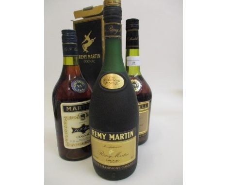 Three bottles of Cognac to include Remy Martin and two bottles of Martell 