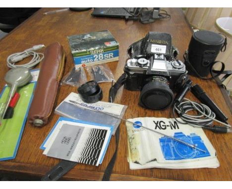 A Minolta XG-M camera and accessories 