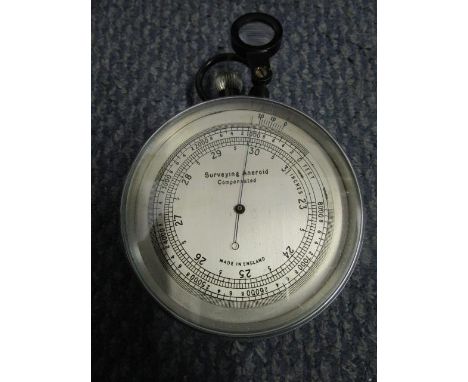 A leather cased Surveying Aneroid Compensation barometer and a MDS Ltd marching compass A/F, in a leather case 