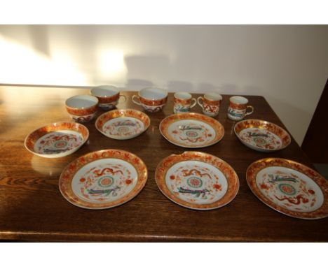 19th Century Chinese Export porcelain part tea/coffee service painted and gilded with phoenix and dragon motifs, within flora