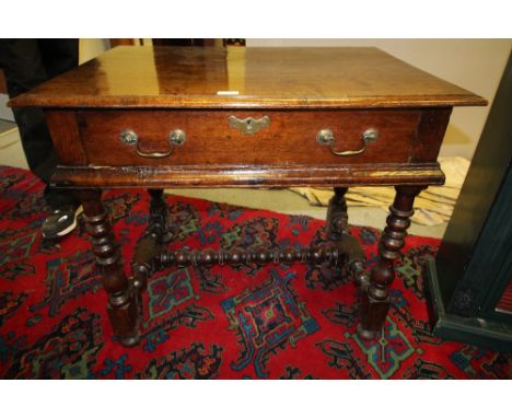 Early 18th Century oak side table, fitted single drawer, with bobbin turned legs and stretcher, 84cm x 60cm x 73cm high (some