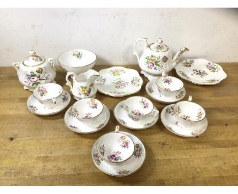 A 19thc tea service with teapot, measures 12cm high, six small teacups and saucers, milk jug, sugar bowl, cake plate and foot