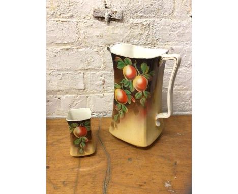 A New Hall Hanley water pitcher with leaf decoration, measures 33cm high with matching vase (2)