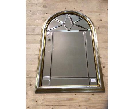 A modern Florentine style wall mirror, each panel bevelled with scroll surmounts and parcel gilt and silvered frame, measures