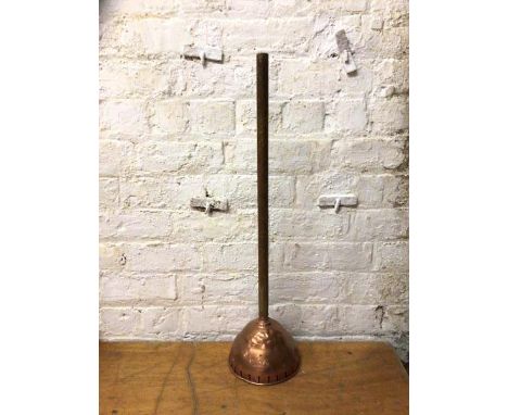 A vintage copper and wood handled washing dolly marked Weekly, 80cm high