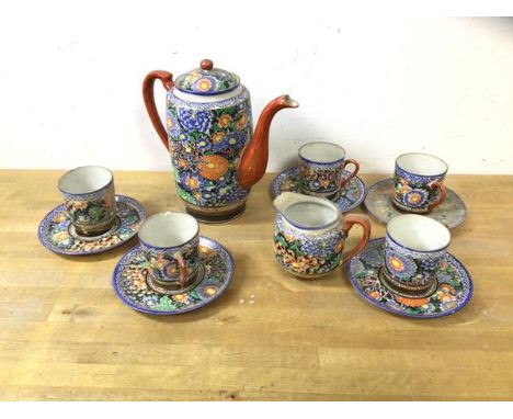 A 1920's/30's Japanese satsuma coffee service including a coffee pot, measures 19cm high, five demitasse cups, saucers and mi