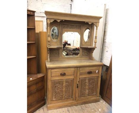 A late 19th / early 20thc stripped satin walnut buffet super-structure with an arrangement of mirrors and shelves over two pa