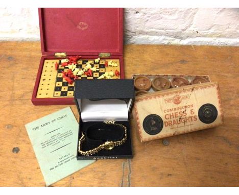 A mixed lot including an Accurist ladies wrist watch, strap a/f, a travelling chess set and a combination chess and draughts 