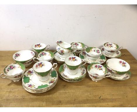 A Paragon part tea set in Rockingham pattern, includes milk jug which measures 10cm high, six short teacups and three tall te