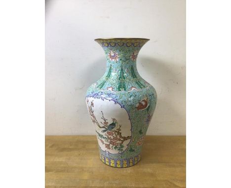 A Chinese baluster shaped vase with flared rim and enamel decoration and flowers a/f, measures 32cm high