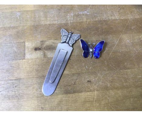 A Birmingham silver bookmark with butterfly finial, measures 8cm high, along with an enamel and silver brooch in the form of 
