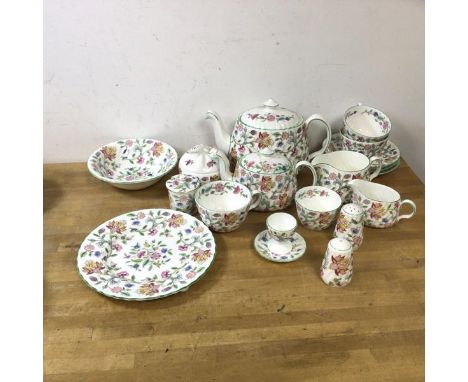 A Minton Haddon Hall pattern part tea set includes teapot which measures 15cm high, along with three teacups, three saucers, 