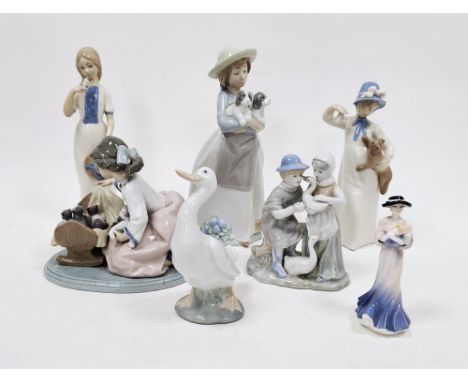 Group of Lladro, Nao, Rex and other porcelain figures similar, including a Lladro group of a girl with kittens, a Nao figure 