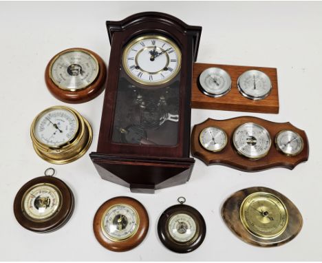 Collection of circular barometers, one mounted with a thermometer, another with thermometer and hydrometer and a modern small