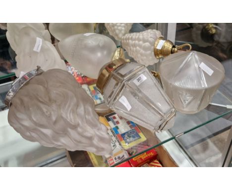 Group of frosted glass lamp shades and pendant light fittings, including two Art Deco style flame-moulded shades, a grape mou