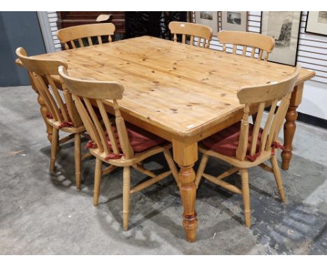 A large pine kitchen table&nbsp;and six pine chairs, the table&nbsp;with single drawer and turned legs,&nbsp;78cm high, 183cm