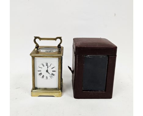 Early 20th century French brass carriage clock, with bevelled glass panels, the white enamel dial with black Roman numerals, 