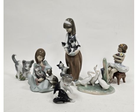 Group of Lladro and Nao figures and models of animals, including a Lladro figure of a girl seated with cat and puppy, a balle