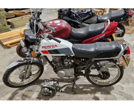 Vintage Honda CG 125 motorcycle, 1991, 124cc, registration H781 GLB, with key. Comes with an additional engine for spares and