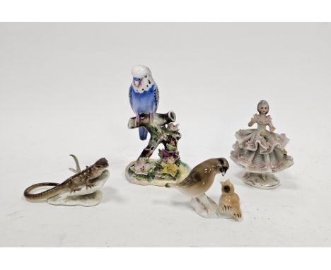 Adderley bone china model of a single blue budgerigar, printed gilt marks, perched on a flower encrusted branch, 12.5cm high,