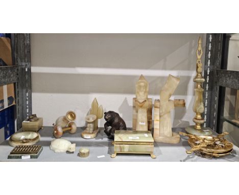 Assorted 20th century onyx desk accessories and other items, including: a pair of bookends, a miniature canon, a lighter, a b