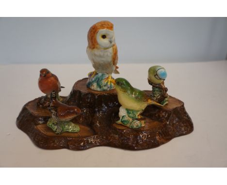 Beswick bird group on ceramic beswick stand 