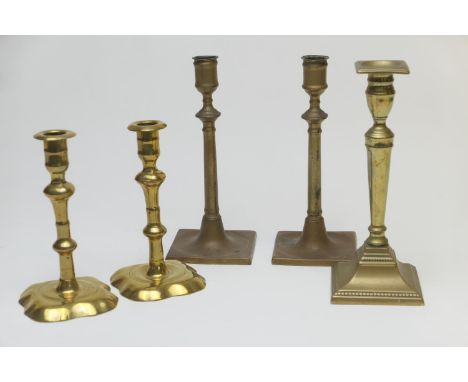 Pair of George III brass knopped column candlesticks, over a shaped square base, height 18cm; also a pair of George III brass