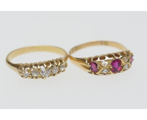 Victorian ruby and diamond cluster ring, in 18ct yellow gold, circa 1880, centred with an oval cut ruby and two smaller rubie