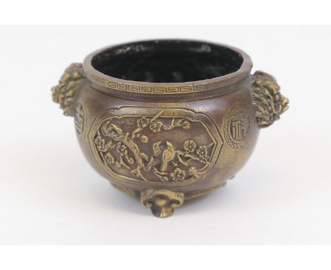 Japanese bronze small censer, cast with mask handles and with panels of birds amidst blossom, cast Chinese seal mark to the b