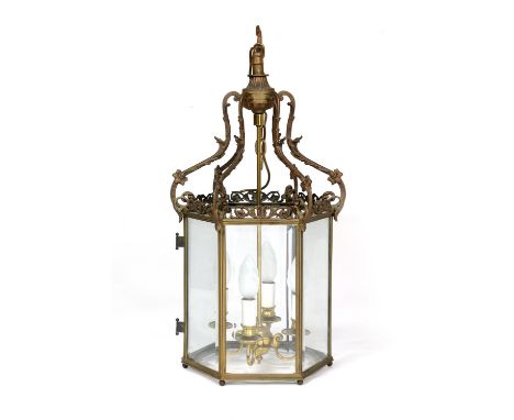 French cast brass hexagonal hall lantern, circa 1900, centred with four candle lights and with clear bevelled glass panels, h