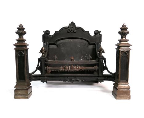 Large cast iron fire grate, probably French, late 19th Century in the Gothic style, the fire box 55cm x 20cm, the fire back 7