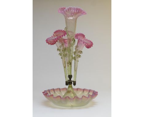 Victorian pink and green glass epergne, late 19th Century, having four trumpets over a frilled base, height 48cm, width 27cm 