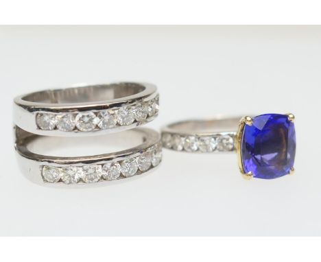Tanzanite and diamond trinity ring, centred with a removable ring set with a cushion cut tanzanite of approx. 3ts, in yellow 