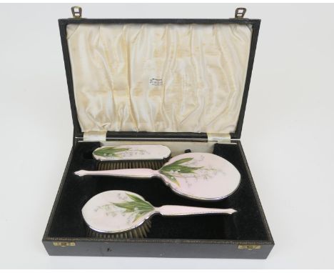 Elizabeth II silver and enamelled vanity set, by Henry Clifford Davis, Birmingham 1953, enamelled with lily-of-the-valley aga