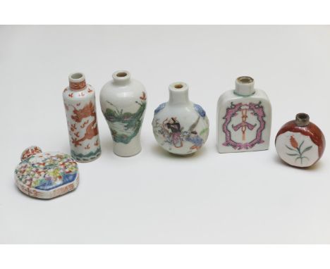 Six Chinese porcelain snuff bottles comprising a dragon decorated cylinder bottle, painted in copper red, Qianlong seal mark,