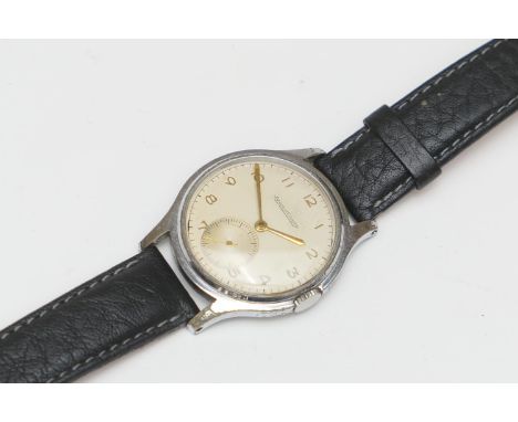 Jaeger LeCoultre stainless steel manual wind wristwatch, circa 1956, case no. 557060, champagne coloured dial with gold Arabi