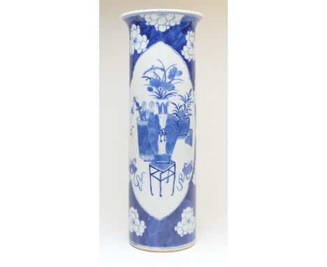 Chinese blue and white cylinder vase, 19th Century, decorated with panels of auspicious objects against a prunus blossom grou