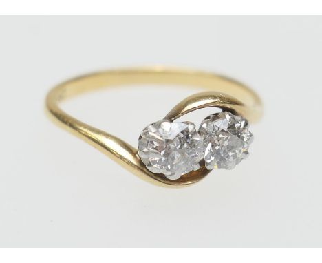 Diamond two stone crossover ring, set with two old round cut diamonds totalling approx. 0.5ct, colour estimated as L/M and cl