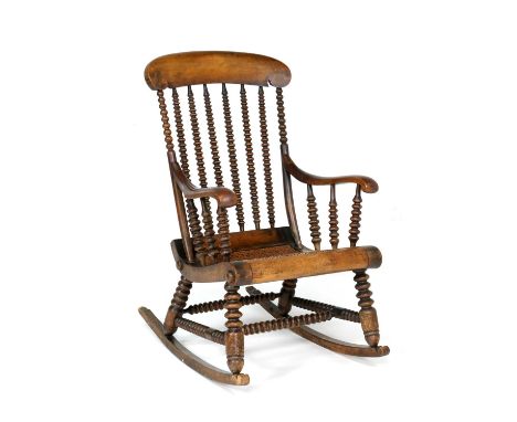 Unusual Victorian bobbin turned rocking chair, circa 1870, stained beech with caned seat, height 104cm, width 60cm (Please no