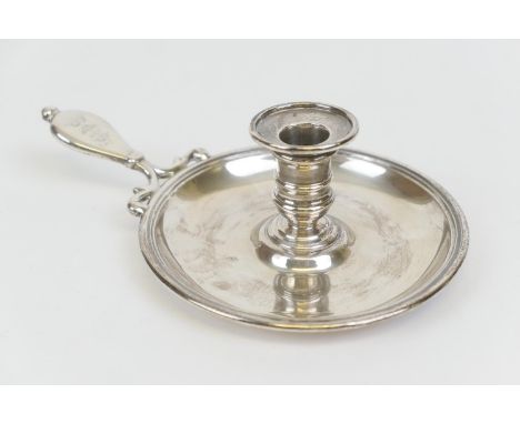 Victorian silver chamberstick, by Robert Garrard II, London 1856, the handle engraved with a crowned crest, the saucer 14cm d