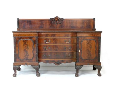 Quality mahogany sideboard in the Chippendale Revival style, having a raised panel back over a central bow front fitted with 
